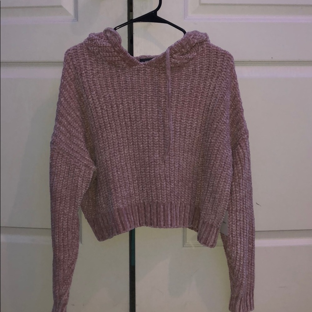 pink patterned sweater.